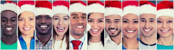 多元文化组快乐的人男人女人在圣诞老人的帽子 — 图库照片