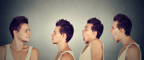 Hombre mirándose a sí mismo expresando diferentes emociones calma, shock, ira — Foto de Stock