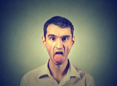 portrait of young man sticking out his tongue clipart