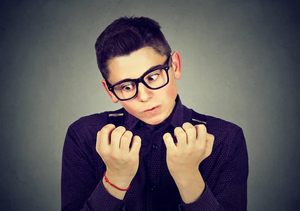 Man looking at hands nails obsessing about cleanliness germs — Stock Photo, Image