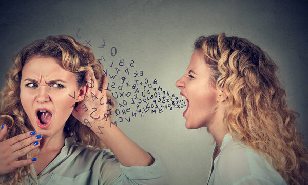 Split personality. Angry woman screaming at shocked herself