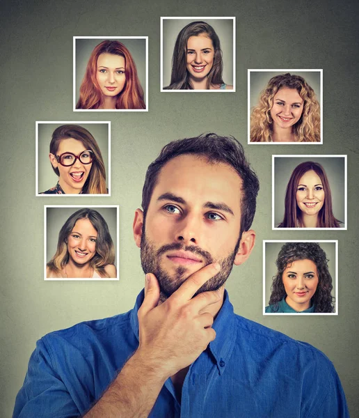 Happy man thinking which woman he likes loves the most — Stock Photo, Image