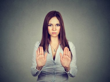 Angry displeased woman raising hands up to say no, stop  clipart