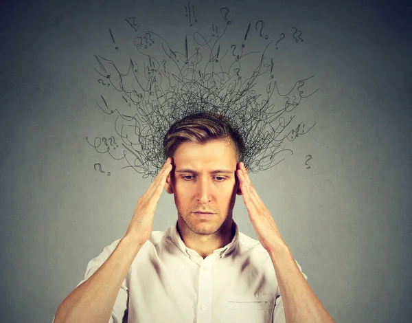 Man with stressed face expression brain melting into lines question marks — Stock Photo, Image