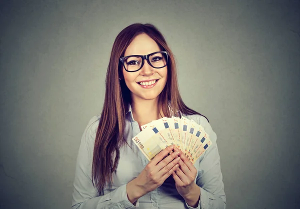 Young business woman holding money Royalty Free Stock Images