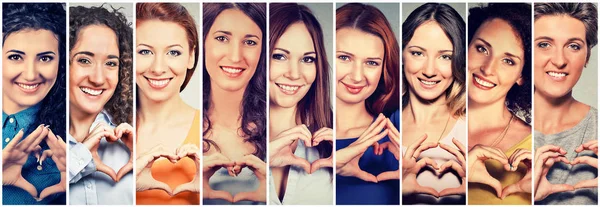 Grupo multiétnico de mulheres felizes fazendo sinal de coração com as mãos — Fotografia de Stock