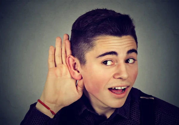 Curious nosy man with hand to ear listening to gossip conversation — Stock Photo, Image