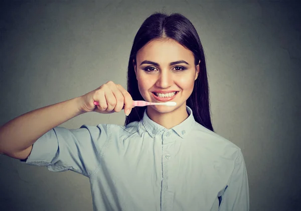 Happy young woman with toothbrush — Stock Photo, Image