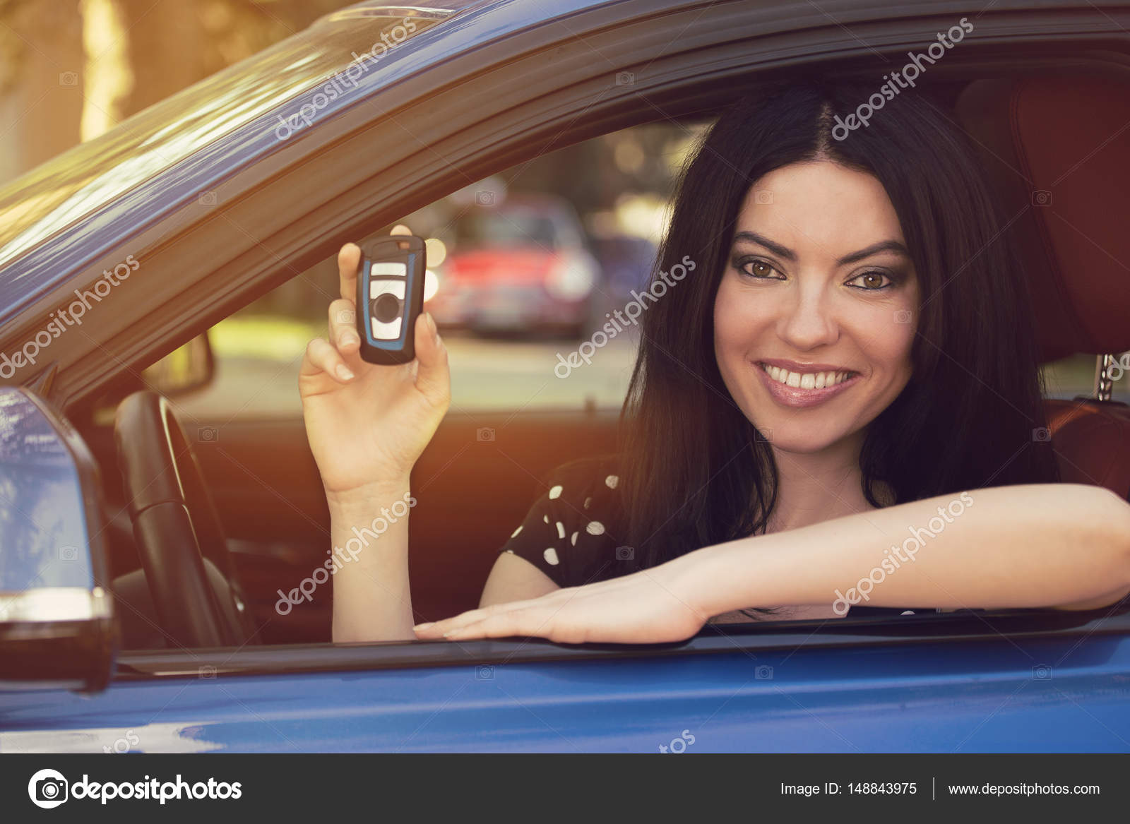 Smiling woman sitting in her new blue car showing keys Stock Photo by  ©SIphotography 148843975