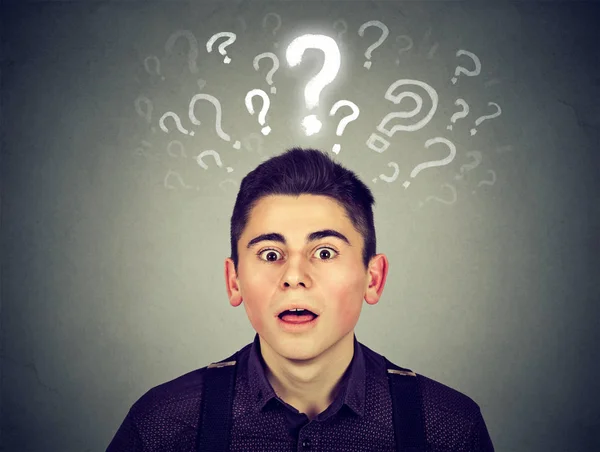 Shocked young man with many questions and no explanation or answer — Stock Photo, Image