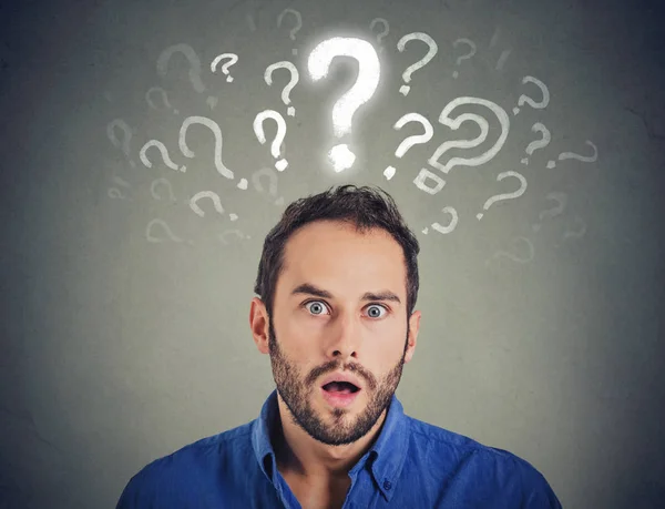 Shocked young man with many questions and no explanation or answer — Stock Photo, Image