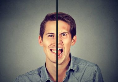 Bipolar bozukluk kavramı. Çift yüz ifadesi ile genç adam 