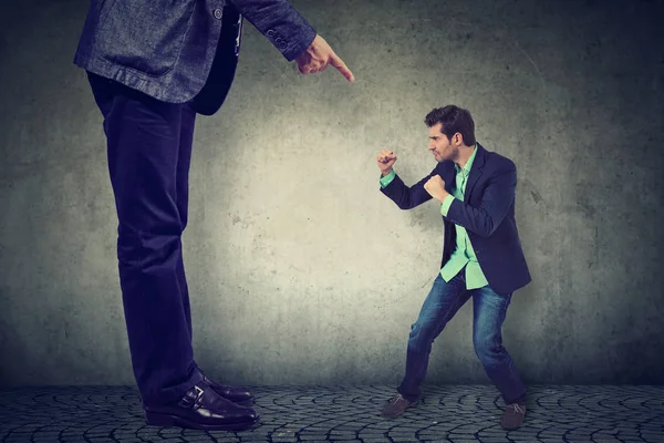 Man fighting against his big boss — Stock Photo, Image