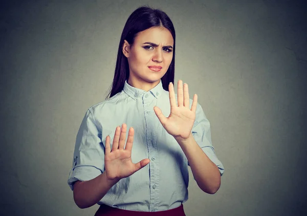 Mujer molesta repeliendo algo con las manos stop gesture — Foto de Stock