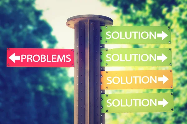 Park signboard with solution and problems arrows pointing in different directions — Stock Photo, Image