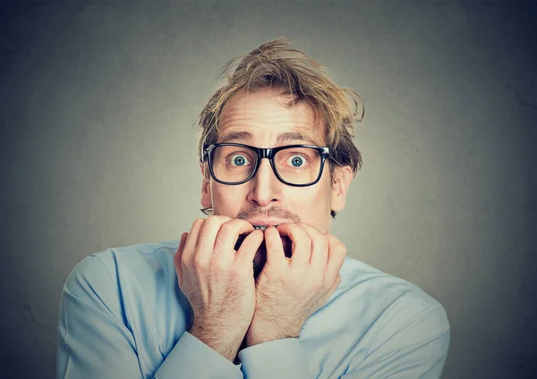 Anxious man biting his fingernails craving for something — Stock Photo, Image