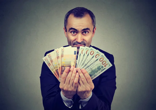 Man holding money euro and dollars banknotes — Stock Photo, Image