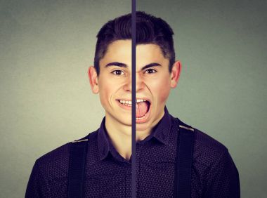 Bipolar bozukluk kavramı. Çift yüz ifadesi ile genç adam