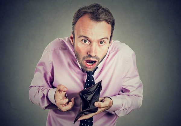 Man with no money. Businessman holding showing empty wallet — Stock Photo, Image