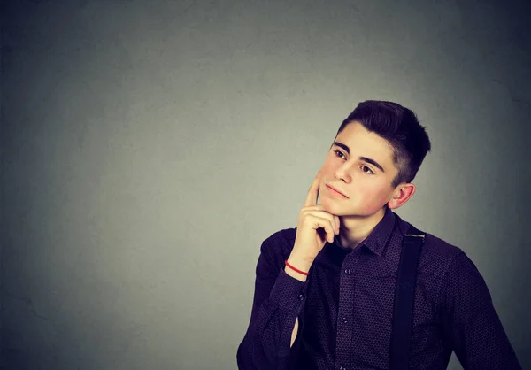 Thoughtful young man looking up — Stock Photo, Image