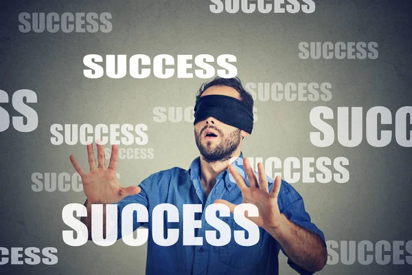 Blindfolded business man looking for success — Stock Photo, Image