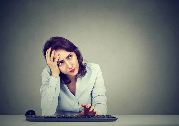 Desperate woman trying to log into her computer forgot password — Stock Photo, Image