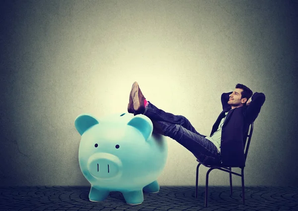 Financially successful business man sitting relaxing in chair — Stock Photo, Image