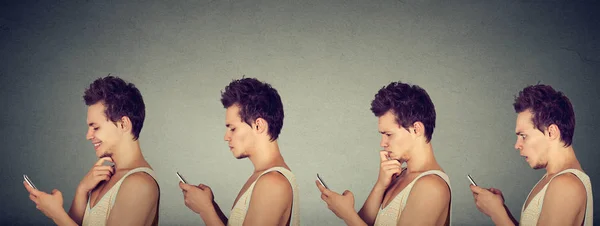 Joven expresando diferentes emociones usando su teléfono móvil — Foto de Stock