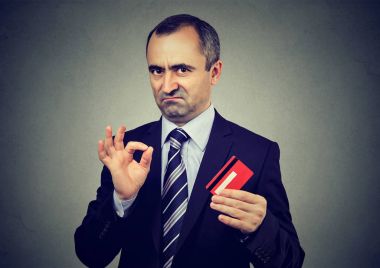 Sly liar mature businessman employee reassuring their credit card is the best  clipart