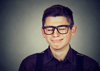Closeup portrait of a crying teenager man clipart