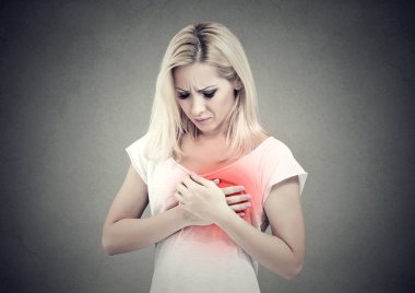 Sick woman with heart attack, pain touching her chest colored in red with hands.  clipart