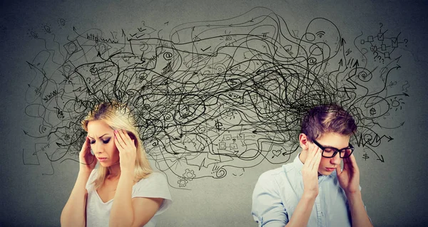 Preoccupied anxious couple woman and man looking away from each other exchanging with many negative thoughts — Stock Photo, Image