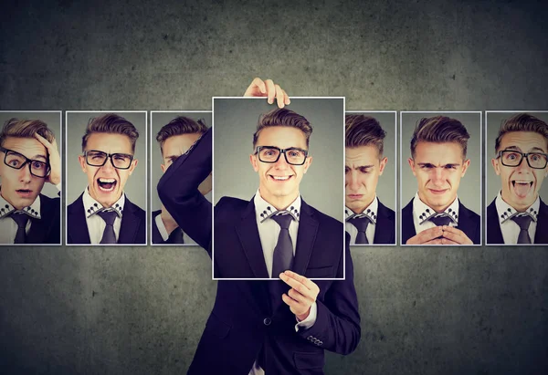 Positieve gemaskerde jonge man in glazen verschillende emoties uitdrukken — Stockfoto