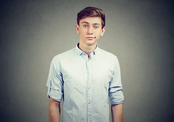 Portrait of skeptical man looking suspicious, with some disgust on his face mixed with disapproval — Stock Photo, Image