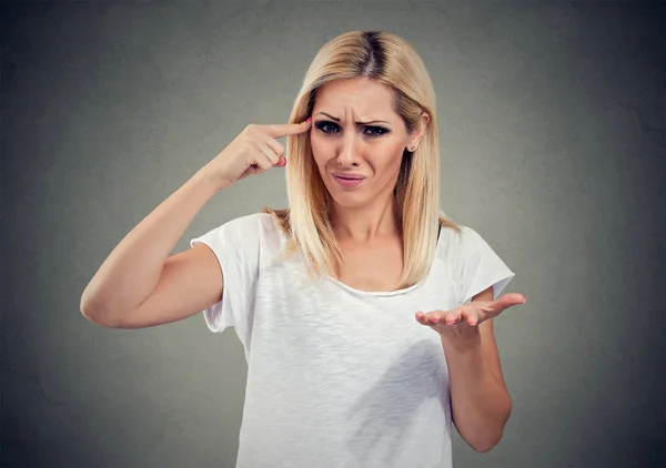 Portrait of angry mad woman gesturing with her finger asking are you crazy? — Stock Photo, Image