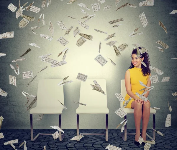 Woman sitting in flying bills — Stock Photo, Image