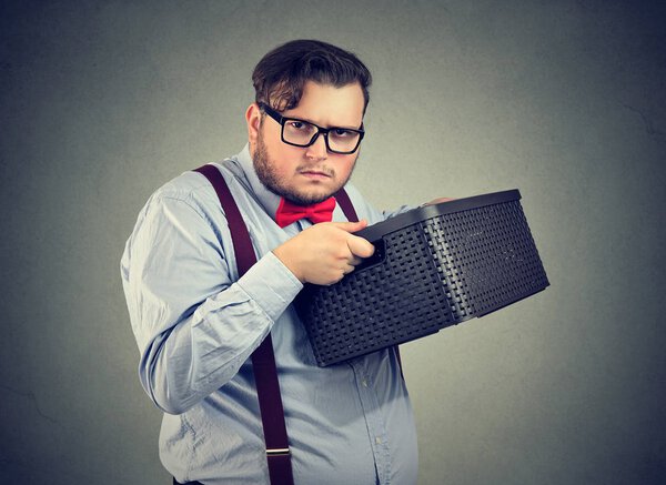 Greedy man holding box