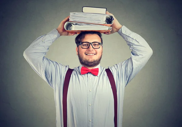 Excited student with books on head — Stock Photo, Image