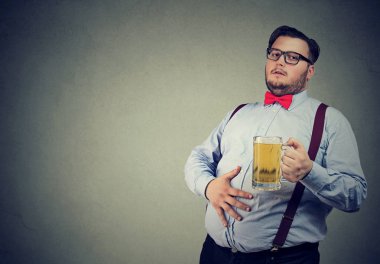 Obese young man full with beer clipart
