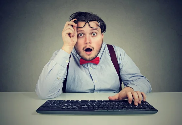 Shocked chunky man with keyboard Stock Photo