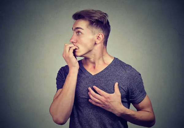 Scared man posing in panic — Stock Photo, Image