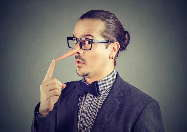 Liar business man with long nose — Stock Photo, Image