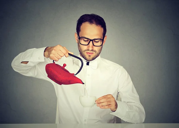 Neat man drinking tea according to tradition — Stock Photo, Image