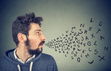 Man talking with alphabet letters coming out of his mouth.  clipart