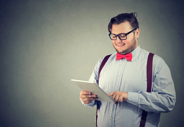 Content man browsing tablet computer — Stock Photo, Image