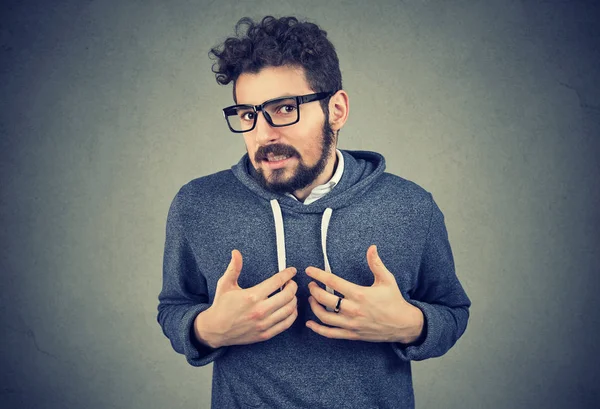 Man feeling embarrassed and looking at camera — Stock Photo, Image