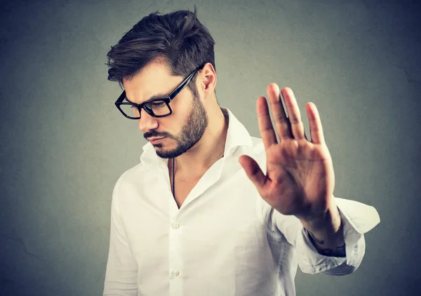 Annoyed angry man with bad attitude giving talk to hand gesture — Stock Photo, Image