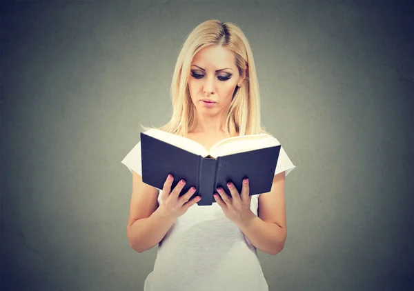 Young woman reading big book — Stock Photo, Image