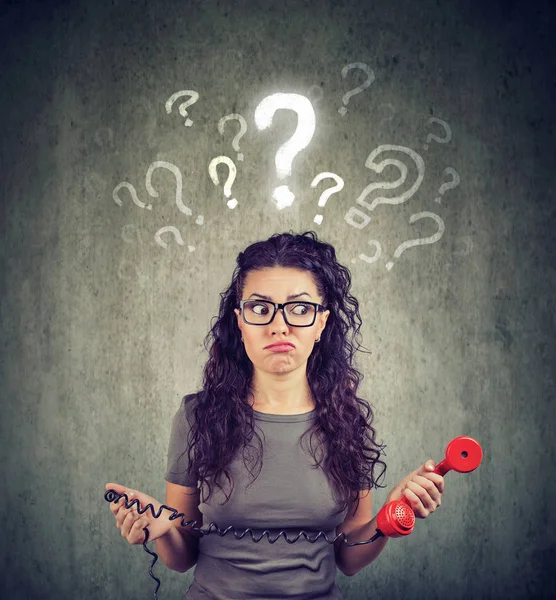 Upset worried confused woman with telephone has many questions — Stock Photo, Image