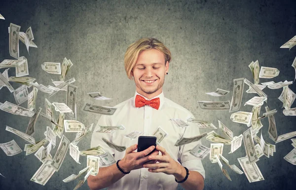 Happy Young Man Using Smartphone Dollar Bills Flying Away Cellphone — Stock Photo, Image